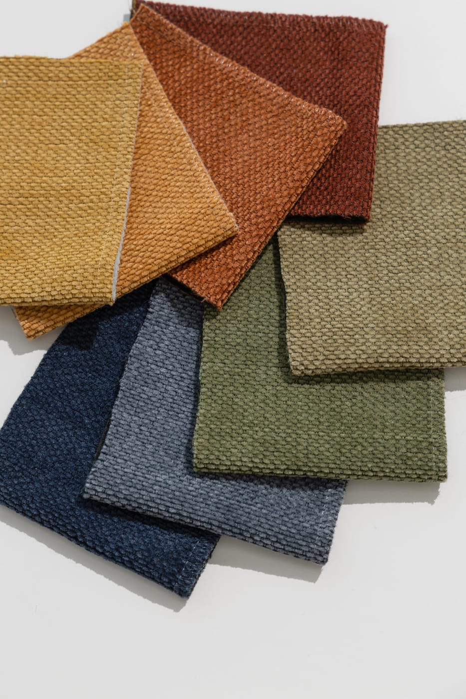 Jiaxing fabric swatches fanned out in warm and cool colours