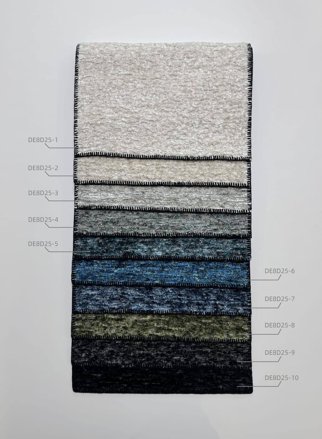 DE8D25 sample hanger with a lustrous melange in grey, blue and green tones