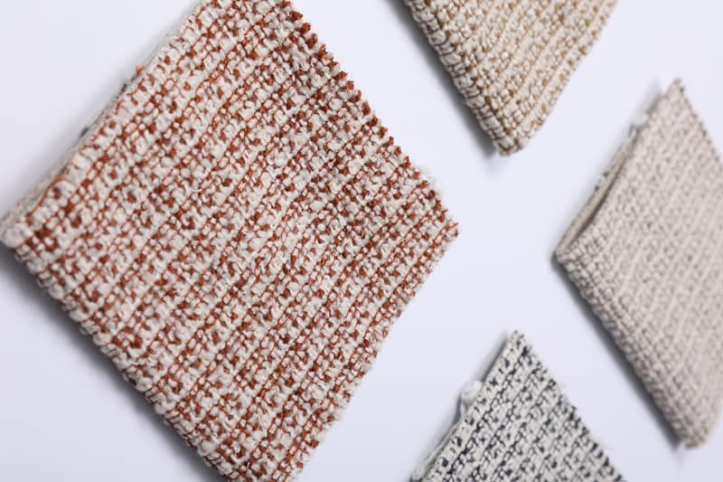 Woven swatches laid at angles on a white table